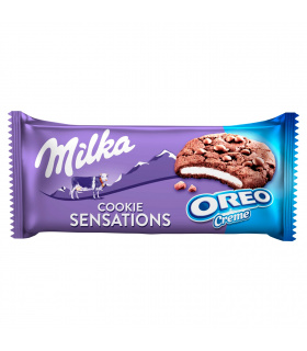 Milka Cookie Sensations Ciastka kakaowe z kawałkami czekolady i nadzieniem o smaku waniliowym 156 g